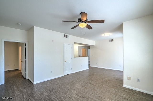 8000 Badura Ave Unit 1168, Las Vegas, NV 89113 - unfurnished living room featuring ceiling fan, dark wood finished floors, and baseboards