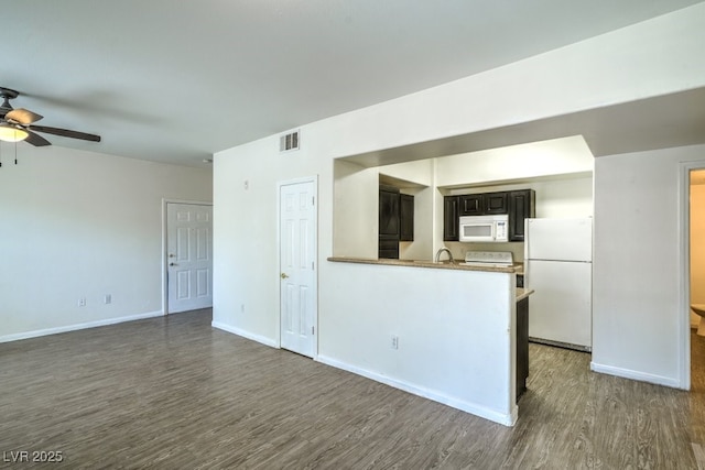 8000 Badura Ave Unit 1168, Las Vegas, NV 89113 - unfurnished living room with wood finished floors, ceiling fan, baseboards, and a sink