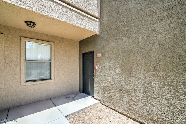 8000 Badura Ave Unit 1168, Las Vegas, NV 89113 - view of exterior entry featuring stucco siding