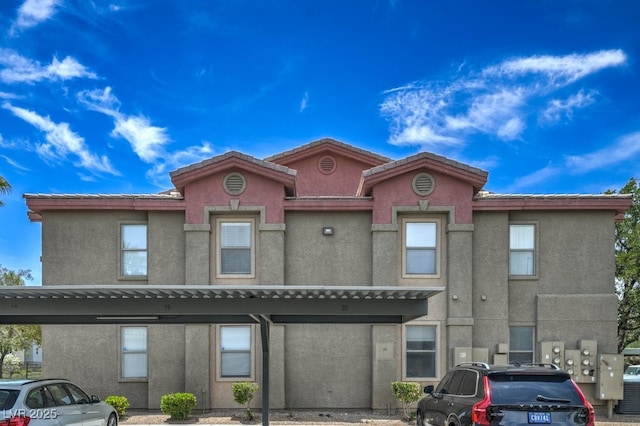 8000 Badura Ave Unit 1168, Las Vegas, NV 89113 - view of property featuring covered parking and stucco siding
