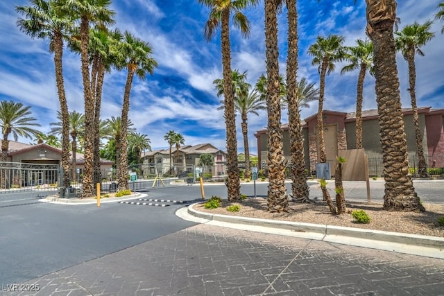8000 Badura Ave Unit 1168, Las Vegas, NV 89113 - view of road featuring a gated entry, curbs, and a residential view