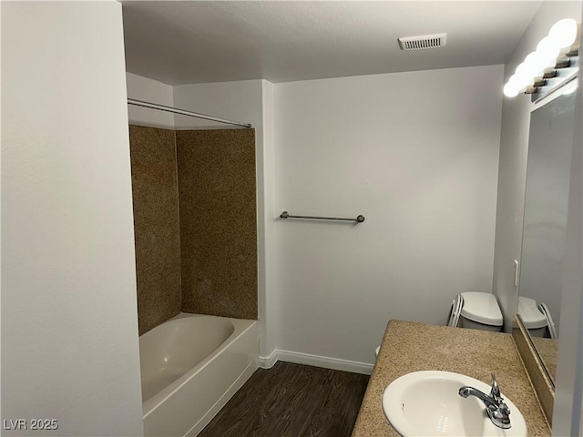 8000 Badura Ave Unit 1168, Las Vegas, NV 89113 - full bath featuring wood finished floors, vanity, and tub / shower combination