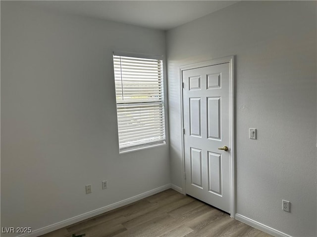 8000 Badura Ave Unit 1168, Las Vegas, NV 89113 - unfurnished room featuring light wood-style floors and baseboards