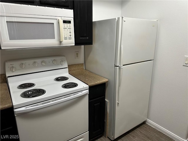 8000 Badura Ave Unit 1168, Las Vegas, NV 89113 - kitchen with white appliances and dark cabinetry