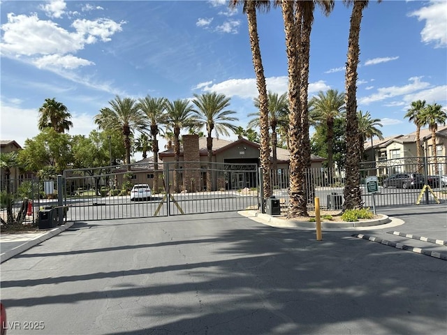 8000 Badura Ave Unit 1168, Las Vegas, NV 89113 - view of asphalt street featuring a gate, a gated entry, and curbs