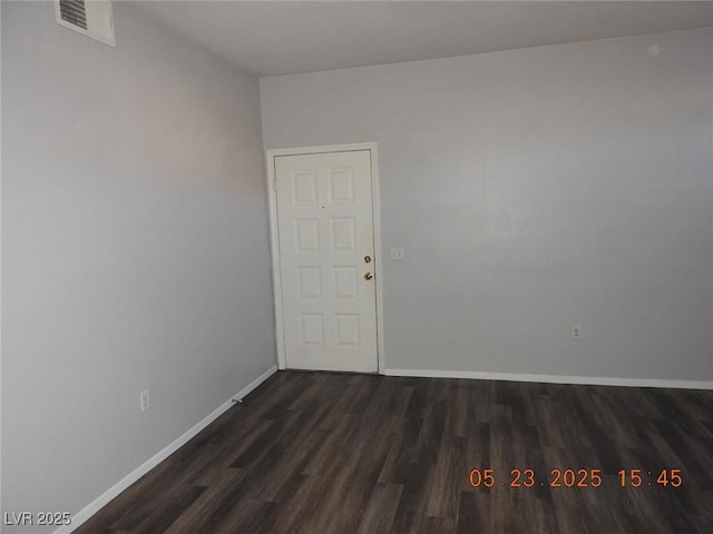 75 N Valle Verde Dr Unit 411, Henderson, NV 89074 - spare room with dark wood-style floors and baseboards