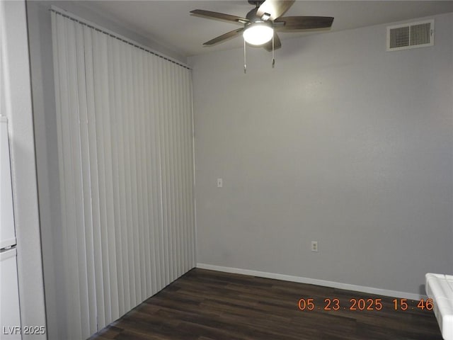75 N Valle Verde Dr Unit 411, Henderson, NV 89074 - unfurnished room featuring a ceiling fan, dark wood-type flooring, and baseboards