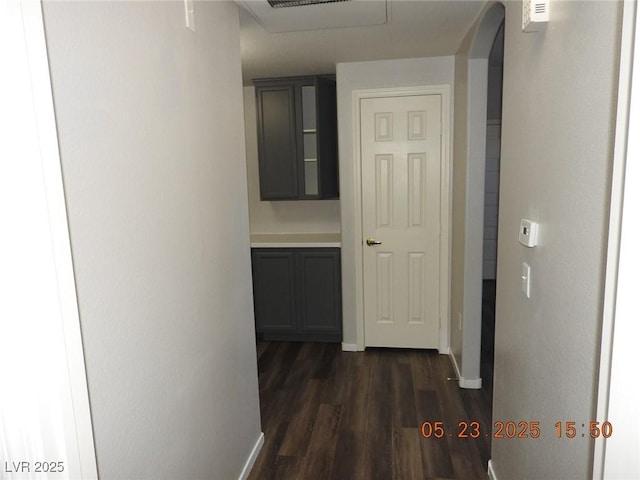 75 N Valle Verde Dr Unit 411, Henderson, NV 89074 - corridor featuring dark wood-type flooring, baseboards, and arched walkways