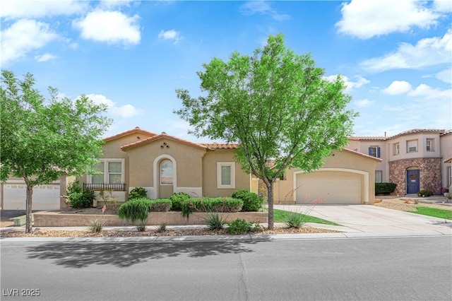 9375 Gold Lake Ave, Las Vegas, NV 89149 - mediterranean / spanish house with concrete driveway, stucco siding, an attached garage, and a tile roof
