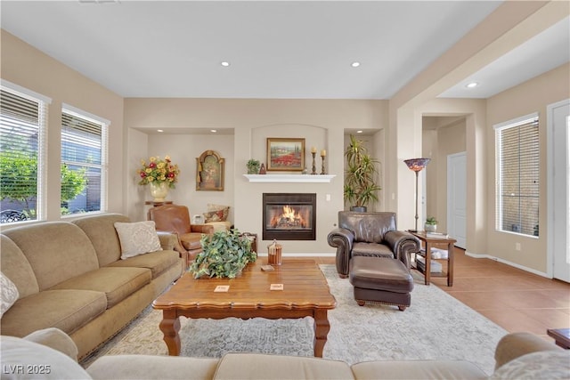 9375 Gold Lake Ave, Las Vegas, NV 89149 - living room featuring a glass covered fireplace, tile patterned floors, recessed lighting, and baseboards