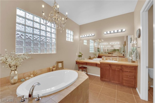 9375 Gold Lake Ave, Las Vegas, NV 89149 - full bath with a chandelier, a bath, vanity, tile patterned floors, and toilet