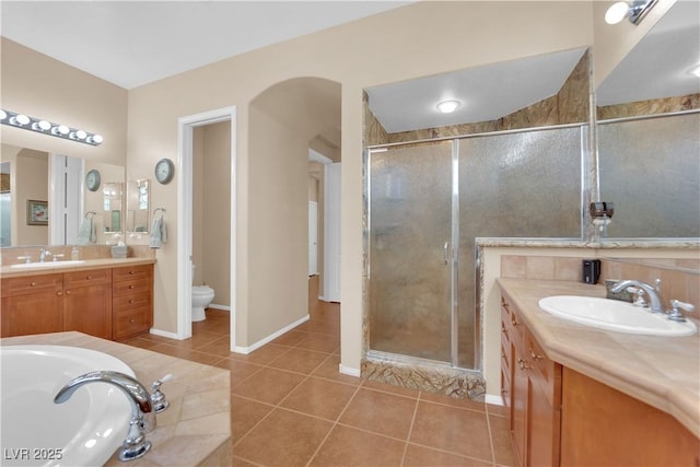 9375 Gold Lake Ave, Las Vegas, NV 89149 - full bathroom featuring a stall shower, two vanities, and tile patterned floors