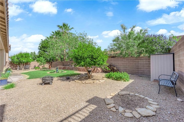 9375 Gold Lake Ave, Las Vegas, NV 89149 - fenced backyard featuring an outdoor fire pit and a patio