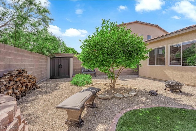 9375 Gold Lake Ave, Las Vegas, NV 89149 - fenced backyard featuring an outdoor fire pit