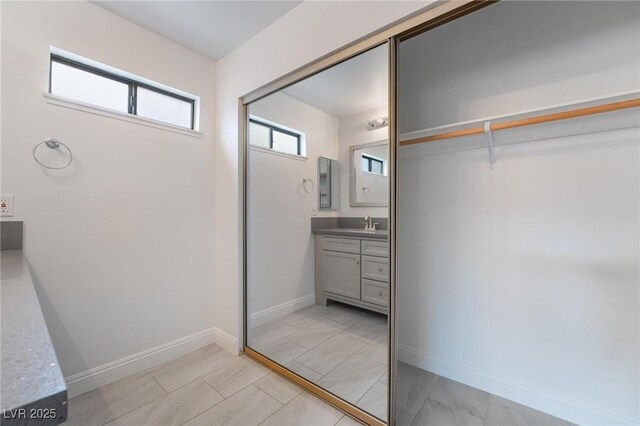 7009 Rawlins Ct, Las Vegas, NV 89128 - bathroom with vanity and baseboards