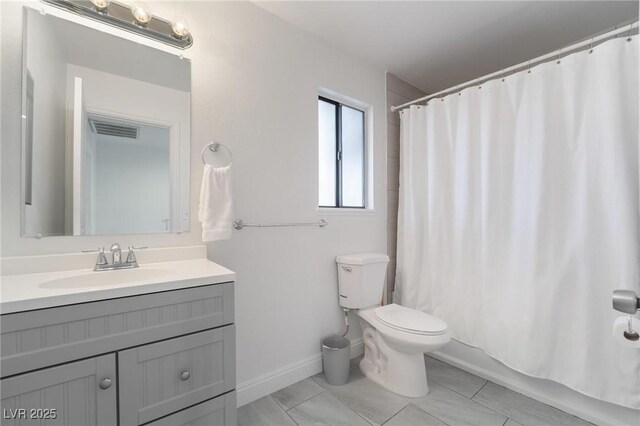 7009 Rawlins Ct, Las Vegas, NV 89128 - full bathroom featuring vanity, toilet, baseboards, and shower / tub combo