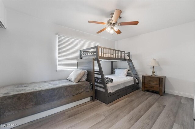 7009 Rawlins Ct, Las Vegas, NV 89128 - bedroom with wood finished floors, baseboards, and ceiling fan