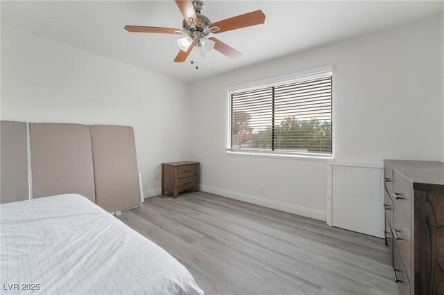 7009 Rawlins Ct, Las Vegas, NV 89128 - bedroom featuring light wood-style flooring and ceiling fan
