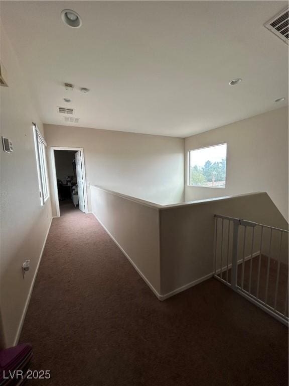 6812 Dipper Ave, North Las Vegas, NV 89084 - corridor with carpet, an upstairs landing, baseboards, and recessed lighting