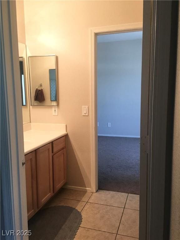 6812 Dipper Ave, North Las Vegas, NV 89084 - bathroom with vanity, tile patterned flooring, and baseboards