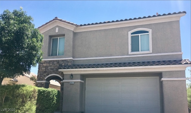 6812 Dipper Ave, North Las Vegas, NV 89084 - view of front of house with an attached garage, stucco siding, and stone siding