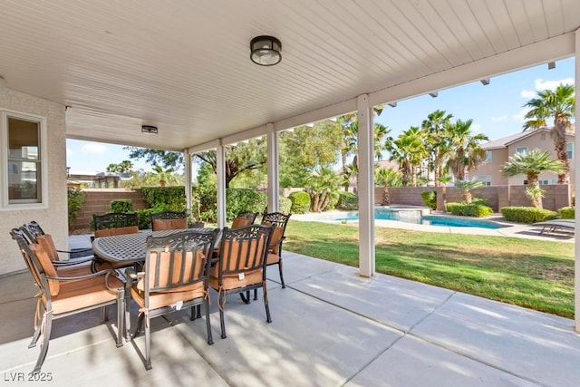 8121 Eagle Clan Ct, Las Vegas, NV 89131 - view of patio with outdoor dining area and an in-ground hot tub