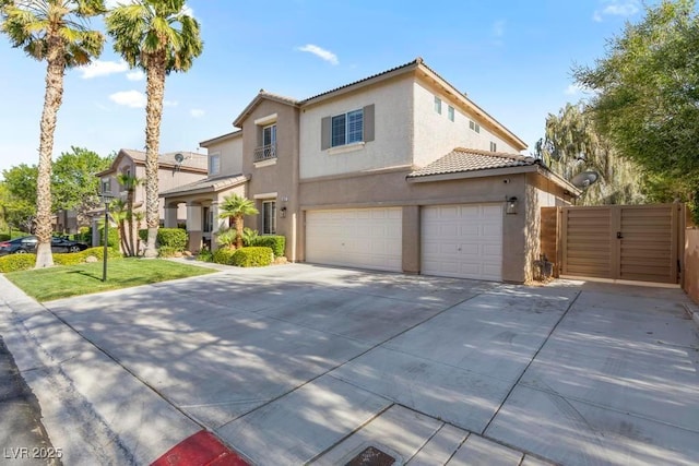 8121 Eagle Clan Ct, Las Vegas, NV 89131 - view of front of house featuring stucco siding, a tiled roof, driveway, an attached garage, and a gate