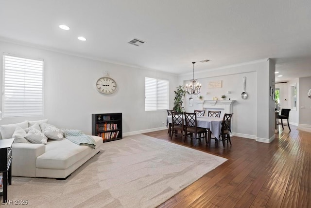 8121 Eagle Clan Ct, Las Vegas, NV 89131 - living room with crown molding, hardwood / wood-style flooring, a chandelier, baseboards, and recessed lighting