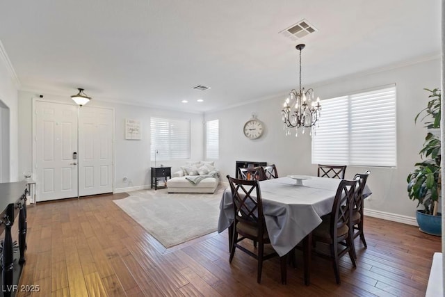 8121 Eagle Clan Ct, Las Vegas, NV 89131 - dining space featuring crown molding, a chandelier, hardwood / wood-style floors, baseboards, and recessed lighting