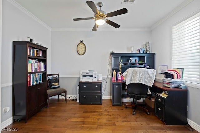 8121 Eagle Clan Ct, Las Vegas, NV 89131 - office area with wood finished floors, crown molding, ceiling fan, and baseboards
