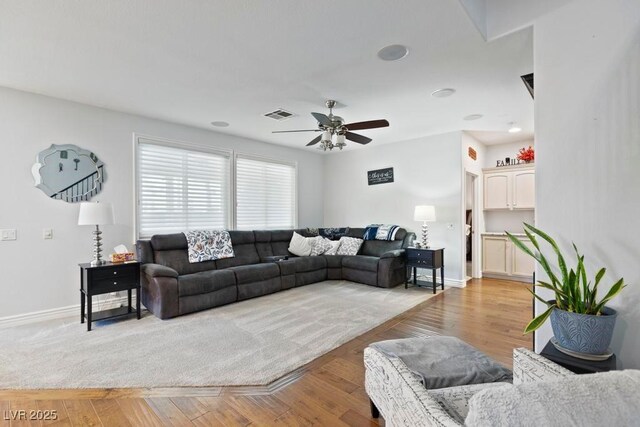 8121 Eagle Clan Ct, Las Vegas, NV 89131 - living room featuring ceiling fan, baseboards, and light wood-style floors