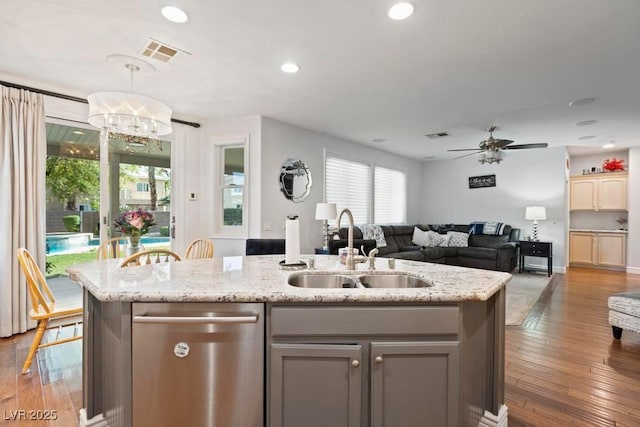 8121 Eagle Clan Ct, Las Vegas, NV 89131 - kitchen featuring a sink, dishwasher, open floor plan, a ceiling fan, and an island with sink