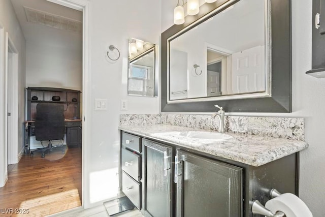 8121 Eagle Clan Ct, Las Vegas, NV 89131 - bathroom with wood finished floors, vanity, and baseboards