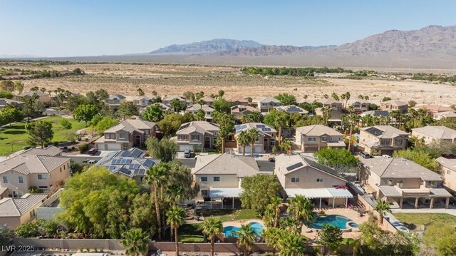 8121 Eagle Clan Ct, Las Vegas, NV 89131 - aerial perspective of suburban area with a mountain backdrop and a pool