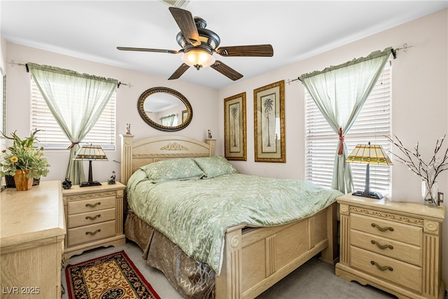 7724 Somerhill Point Way, Las Vegas, NV 89139 - bedroom with multiple windows, light colored carpet, and a ceiling fan