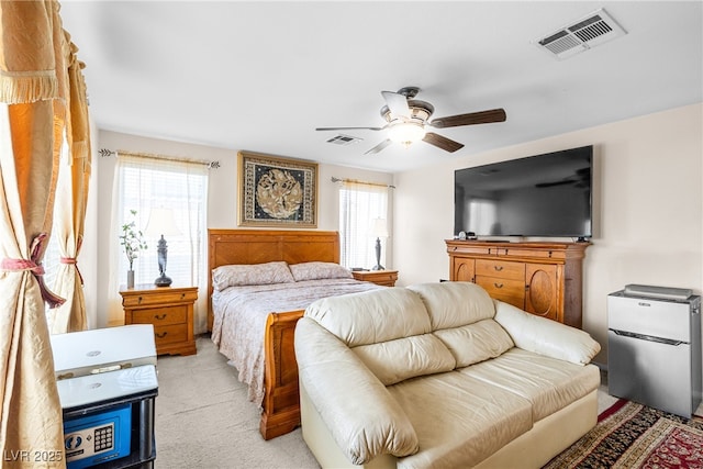 7724 Somerhill Point Way, Las Vegas, NV 89139 - bedroom featuring multiple windows, light carpet, and ceiling fan