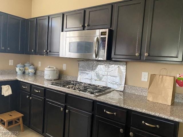 152 Lotus Vale Ave, Las Vegas, NV 89123 - kitchen with stainless steel appliances and light stone counters