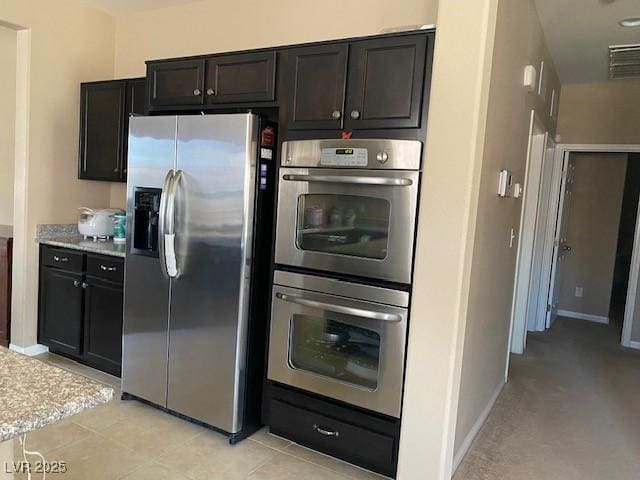 152 Lotus Vale Ave, Las Vegas, NV 89123 - kitchen with appliances with stainless steel finishes, light countertops, and baseboards