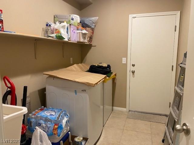 152 Lotus Vale Ave, Las Vegas, NV 89123 - laundry area with light tile patterned floors and baseboards
