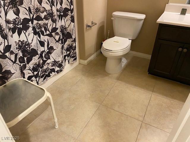 152 Lotus Vale Ave, Las Vegas, NV 89123 - bathroom featuring vanity, toilet, baseboards, and tile patterned floors