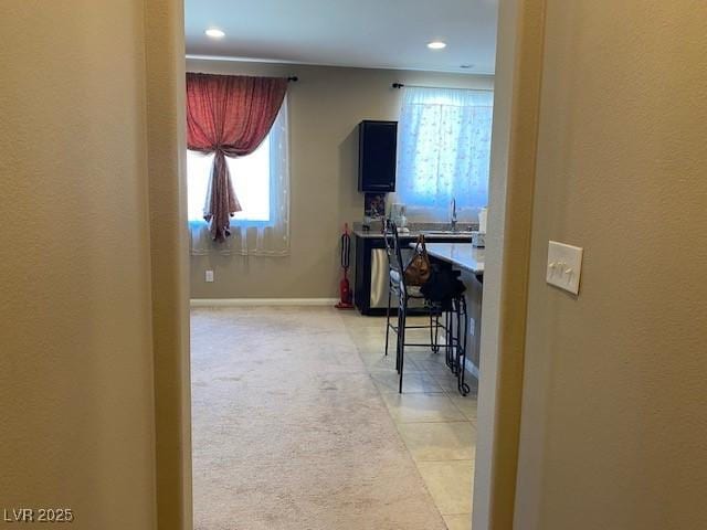 152 Lotus Vale Ave, Las Vegas, NV 89123 - hallway featuring healthy amount of natural light, a sink, recessed lighting, and baseboards
