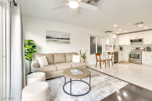 2429 Worchester Rd, Henderson, NV 89074 - living area with a ceiling fan, recessed lighting, and wood finished floors