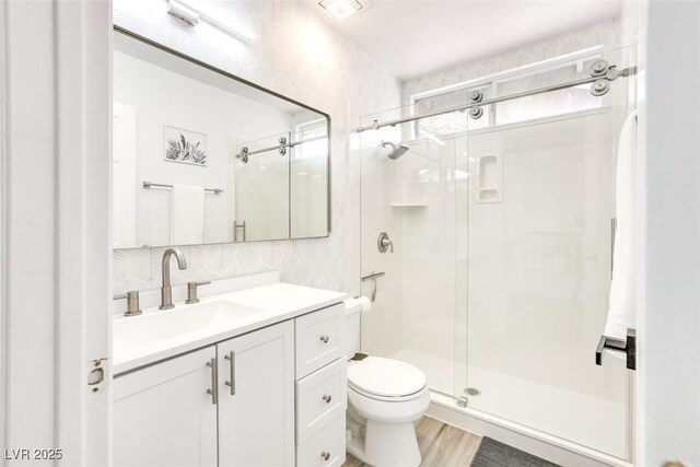 2429 Worchester Rd, Henderson, NV 89074 - bathroom featuring a stall shower, toilet, and vanity