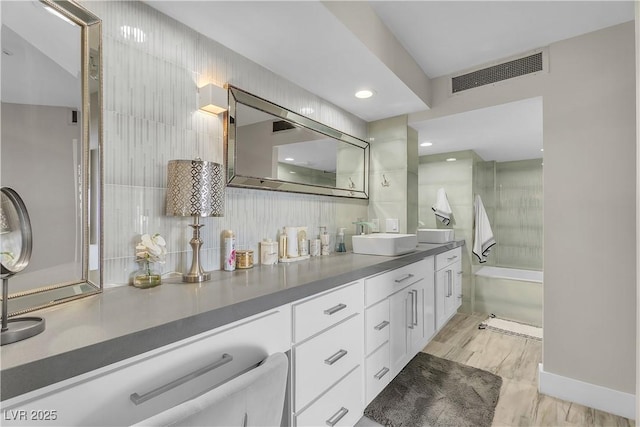 3111 Bel Air Dr Unit 22B, Las Vegas, NV 89109 - bathroom with double vanity and backsplash