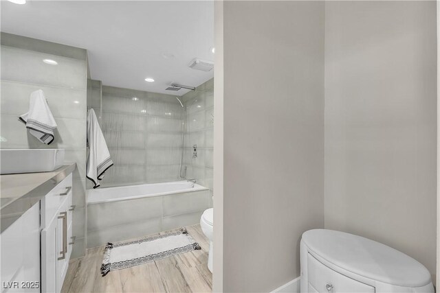 3111 Bel Air Dr Unit 22B, Las Vegas, NV 89109 - full bath featuring tiled shower / bath combo, vanity, and recessed lighting