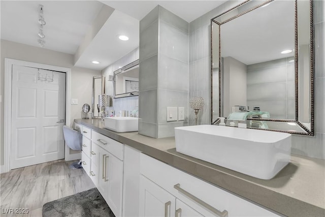 3111 Bel Air Dr Unit 22B, Las Vegas, NV 89109 - bathroom featuring double vanity, rail lighting, and recessed lighting