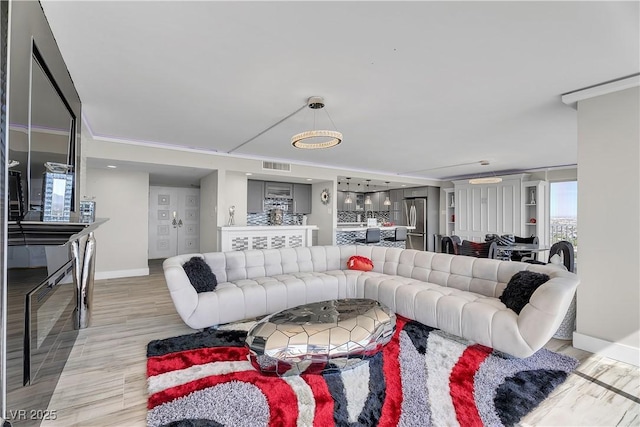 3111 Bel Air Dr Unit 22B, Las Vegas, NV 89109 - living area with light wood finished floors and baseboards