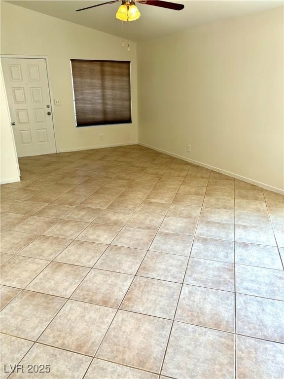 3665 Lucky Horseshoe Ct, Las Vegas, NV 89129 - spare room featuring a ceiling fan, light tile patterned floors, and baseboards