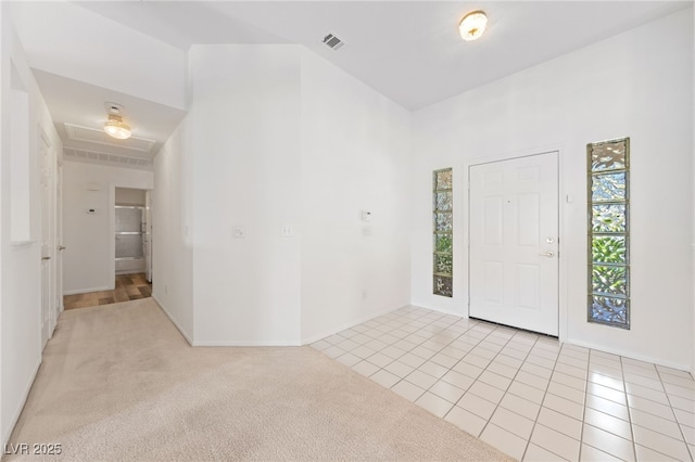 5232 Saranac Rd, Las Vegas, NV 89130 - entryway featuring healthy amount of natural light, light tile patterned floors, and light carpet