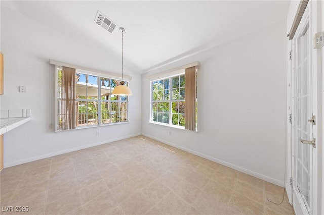 5232 Saranac Rd, Las Vegas, NV 89130 - unfurnished dining area with baseboards and vaulted ceiling